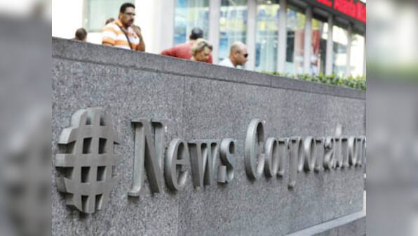 NewsCorp board approves of splitting Murdoch's empire