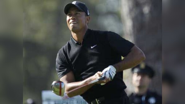 US Open: Woods in joint lead, McIlroy's title defence collapses