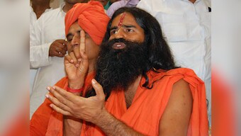 Ramdev meets Naidu; says PM can't smile as he is under pressure