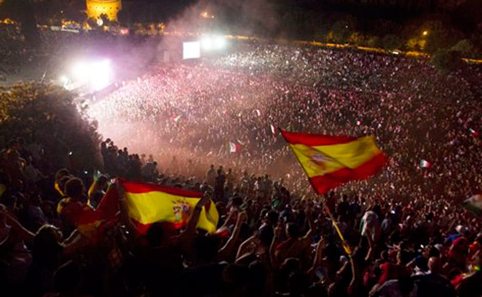 Spanish fans celebrate the victory. AP Spanish fans celebrate the victory. AP