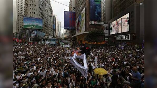 Crowds protest in Hong Kong as Hu anoints leader