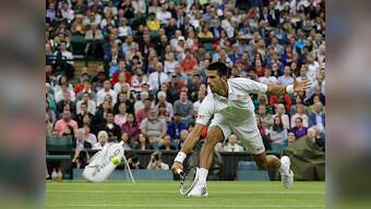 Wimbledon: Djokovic cruises, Federer wins despite back scare
