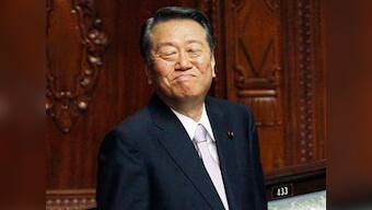 Dozens quit Japan's ruling party in blow to PM