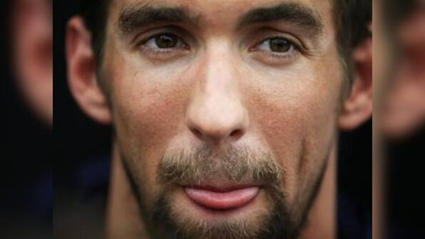 Olympics: Phelps' shaggy appearance hides ambitions