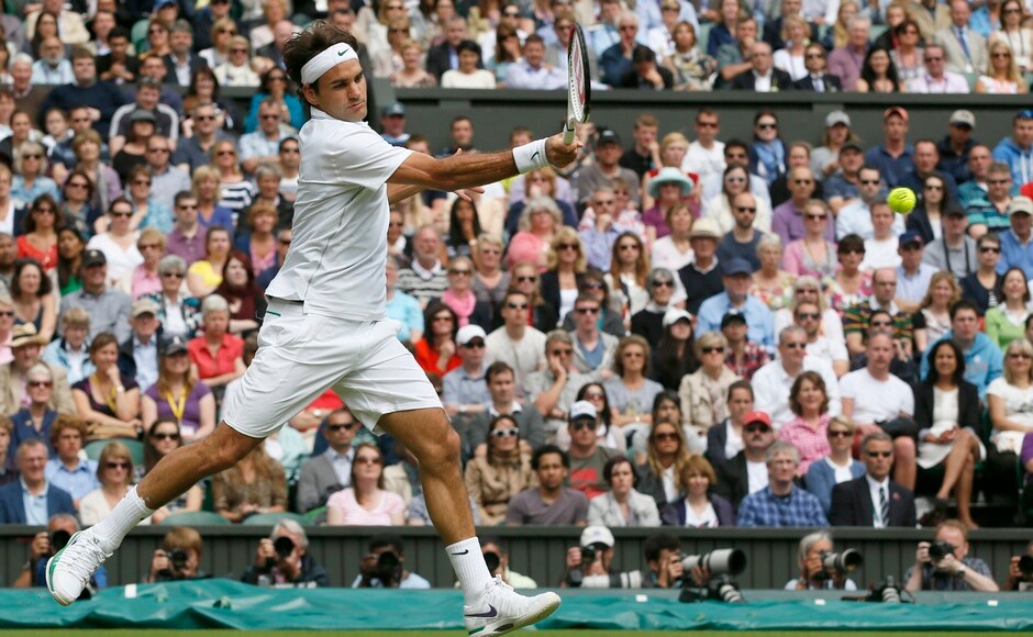 Federer hits a return to Mikhail Youzhny of Russia during their men's quarter-final tennis match at the Wimbledon tennis championships in London July 4, 2012. Reuters Federer hits a return to Mikhail Youzhny of Russia during their men's quarter-final tennis match at the Wimbledon tennis championships in London July 4, 2012. Reuters