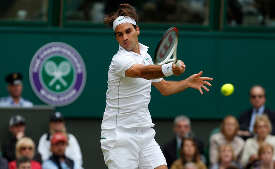 Federer hits a return to Xavier Malisse of Belgium during their men's singles tennis match at the Wimbledon tennis championships in London July 2, 2012. Reuters Federer hits a return to Xavier Malisse of Belgium during their men's singles tennis match at the Wimbledon tennis championships in London July 2, 2012. Reuters