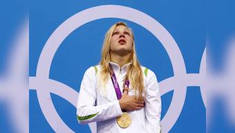 Lithuania's Meilutyte, aged 15, wins gold in 100m breaststroke