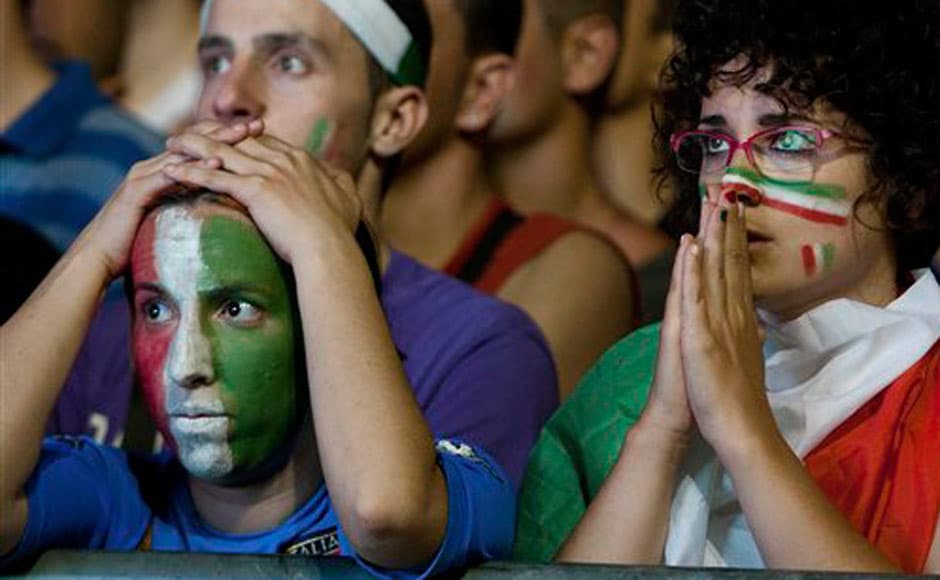 Italian supporters react during the Euro 2012 final. AP Italian supporters react during the Euro 2012 final. AP