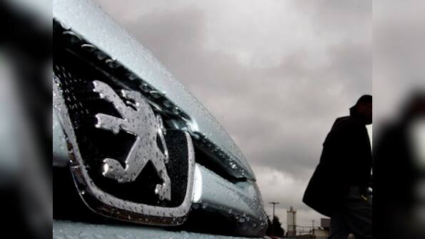 Mounting losses force Peugeot to cut 8,000 jobs