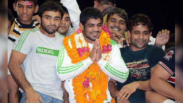Images: Olympic heroes Sushil, Yogeshwar return home