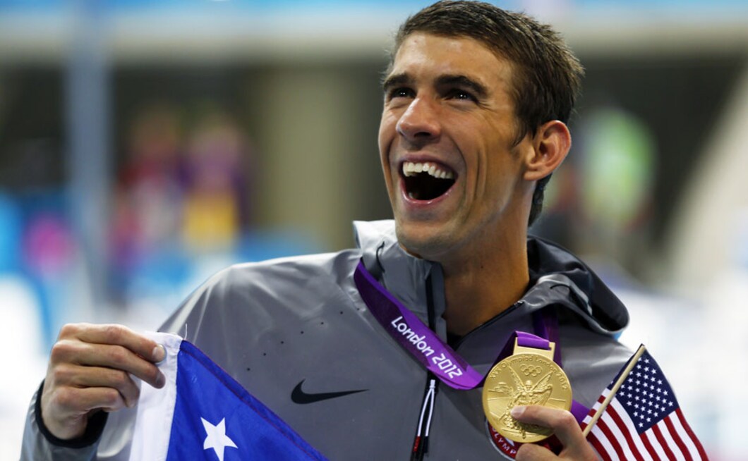 15 gold, 2 silver and 2 bronze That's Michael Phelps for you