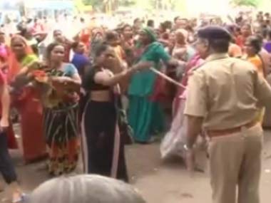 Police disperse crowds at Gujarat govt's cheap housing scheme Police disperse crowds at Gujarat govt's cheap housing scheme