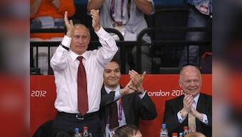 Putin, a black belt, celebrates Russia's judo win