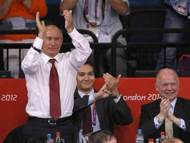 Putin, a black belt, celebrates Russia's judo win Putin, a black belt, celebrates Russia's judo win