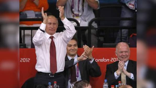 Putin, a black belt, celebrates Russia's judo win
