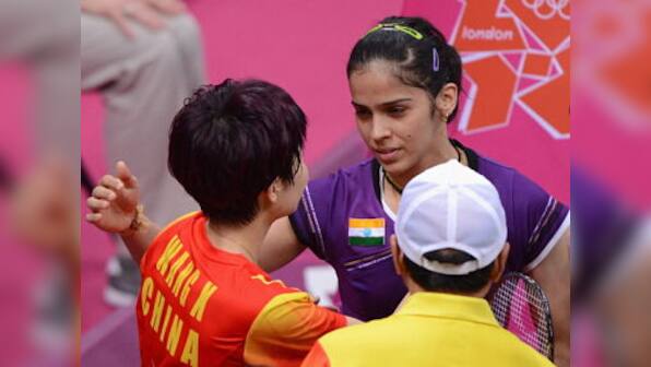 Saina bags bronze after Wang retires hurt