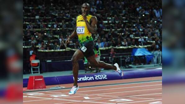 London 2012: Usain Bolt sprints into record books with 200m win