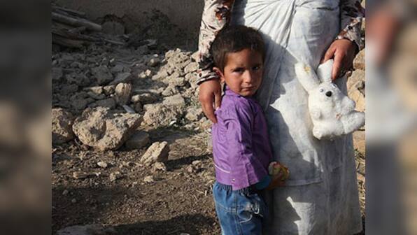 Iran mellows in quake aftermath, seeks foreign aid