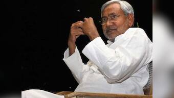 Nitish Kumar celebrates by tying rakhi to trees