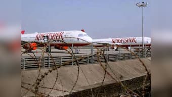 Kingfisher shares fly 20% despite wider loss