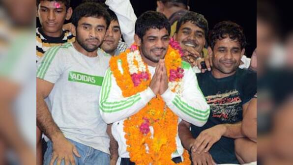 Mary Kom, Sushil, Yogeshwar arrive to heroes' welcome