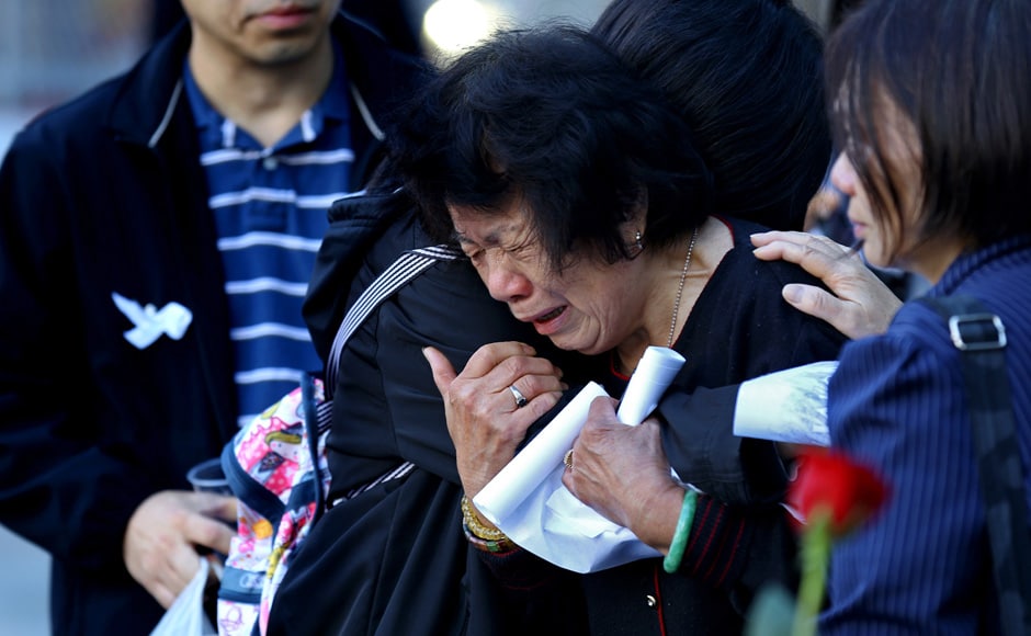 A woman weeps along the South Pool wall of the 9/11 Memorial during ceremonies marking the 11th anniversary of the 9/11 attacks on the World Trade Center in New York. Reuters A woman weeps along the South Pool wall of the 9/11 Memorial during ceremonies marking the 11th anniversary of the 9/11 attacks on the World Trade Center in New York. Reuters