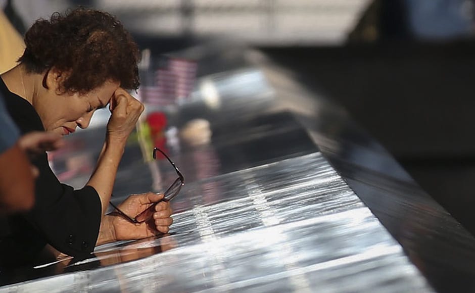Relative who lost her son pauses during ceremonies marking the 11th anniversary of the 9/11 attacks on the World Trade Center in New York. Reuters Relative who lost her son pauses during ceremonies marking the 11th anniversary of the 9/11 attacks on the World Trade Center in New York. Reuters