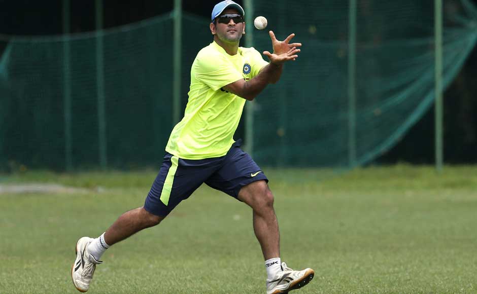 Not that Dhoni will need to do a lot of long catching without his gloves, but the Indian skipper gives it a go anyway. AP Not that Dhoni will need to do a lot of long catching without his gloves, but the Indian skipper gives it a go anyway. AP