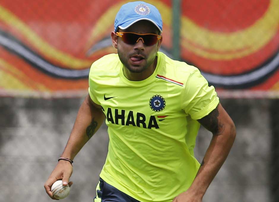 The usually playful Virat Kohli is intense in this photograph as he runs with the ball in his hand. Practicing running run-outs maybe... AP The usually playful Virat Kohli is intense in this photograph as he runs with the ball in his hand. Practicing running run-outs maybe... AP