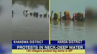 MP villagers stand in neck-deep water to protest against dam