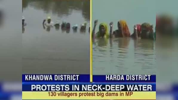 MP villagers stand in neck-deep water to protest against dam