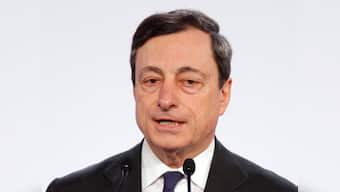 ECB says no limit on new bond buys; cuts growth forecast