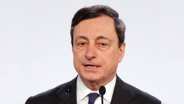 ECB says no limit on new bond buys; cuts growth forecast