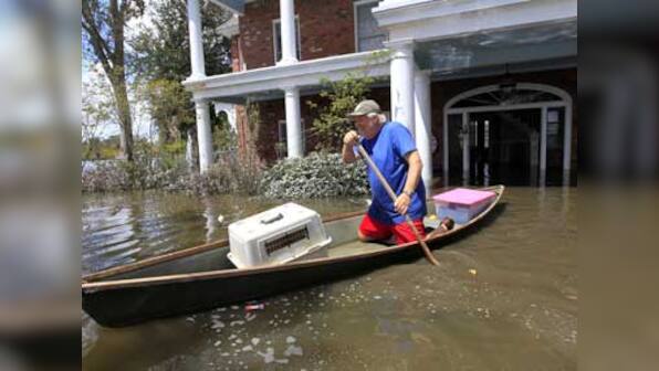 Days after Isaac, flooding and outages remain