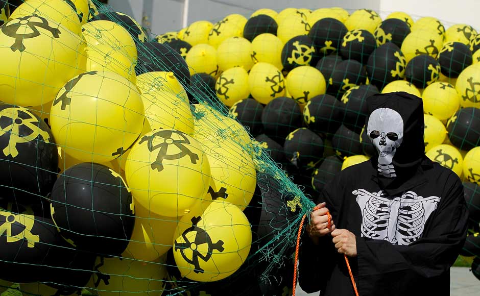 <br />An activist wearing a skeleton costume holds balloons with radiation symbols on them tethered prior to releasing them at an anti-nuclear demonstration outside the Chancellery on 5 September 2010 in Berlin, Germany. Sean Gallup/Getty Images <br />An activist wearing a skeleton costume holds balloons with radiation symbols on them tethered prior to releasing them at an anti-nuclear demonstration outside the Chancellery on 5 September 2010 in Berlin, Germany. Sean Gallup/Getty Images