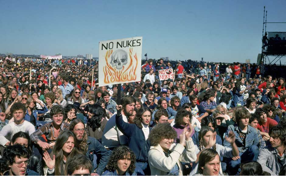 <br />People hold up signs creading, <br />People hold up signs creading,