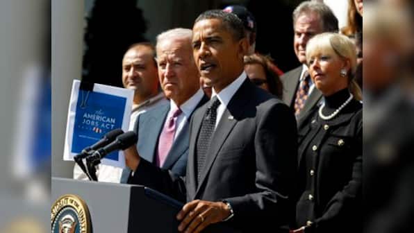 Obama files trade complaint against China, raps Romney
