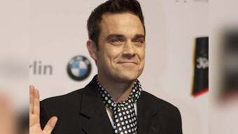 Pop star Robbie Williams becomes a dad