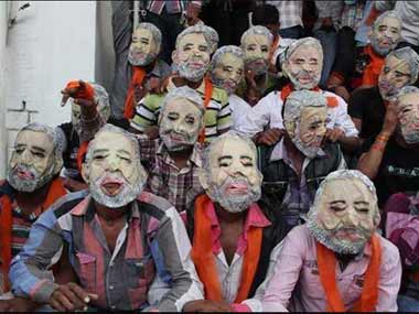 Gujarat polls: BJP stops giving out 'scary' Modi masks Gujarat polls: BJP stops giving out 'scary' Modi masks