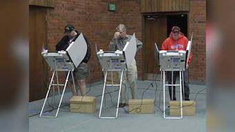 Global stocks climb as US votes, euro steady