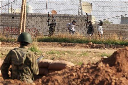 On Syrian border, mixed feelings for rebel 'liberators' On Syrian border, mixed feelings for rebel 'liberators'