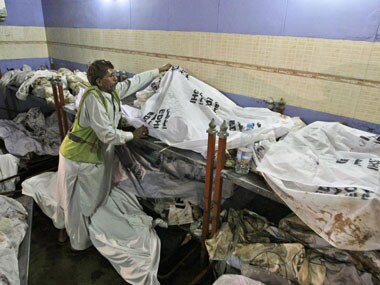 More than a month after Pak factory fire, families wait for bodies of kin