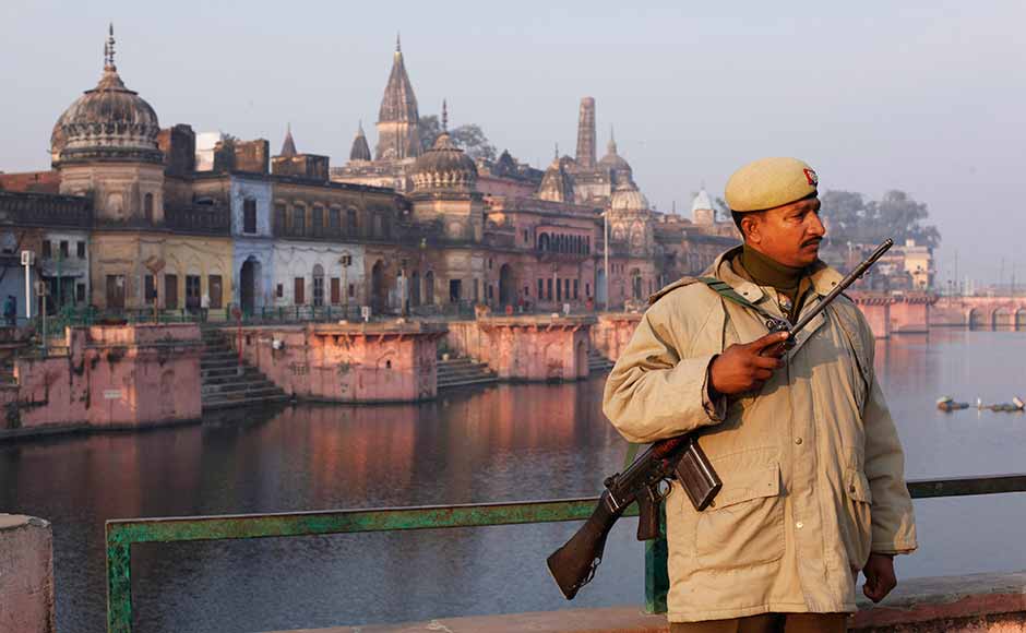 A policeman stands guard near a Hindu temple, on the eve of the anniversary of the Babri mosque demolition in Ayodhya. In 1992, tens of thousands of Hindu extremists destroyed the 16th century Babri mosque at Ayodhya as security forces watched. Hindus say it is the birthplace of their god Rama and contend a temple to him stood on the site before the mosque. Rajesh Kumar Singh/AP A policeman stands guard near a Hindu temple, on the eve of the anniversary of the Babri mosque demolition in Ayodhya. In 1992, tens of thousands of Hindu extremists destroyed the 16th century Babri mosque at Ayodhya as security forces watched. Hindus say it is the birthplace of their god Rama and contend a temple to him stood on the site before the mosque. Rajesh Kumar Singh/AP