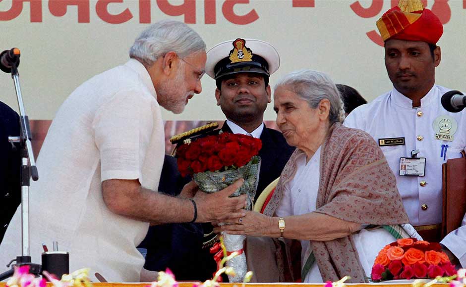 Gujarat Governor Kamla Beniwal greets BJP leader Narendra Modi after he took oath as the Chief Minister of the state for the fourth time at Sardar Patel Stadium in Ahmedabad. PTI Gujarat Governor Kamla Beniwal greets BJP leader Narendra Modi after he took oath as the Chief Minister of the state for the fourth time at Sardar Patel Stadium in Ahmedabad. PTI