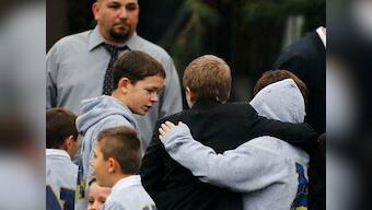 Funerals begin for Newtown victims as U.S. schools confront tragedy