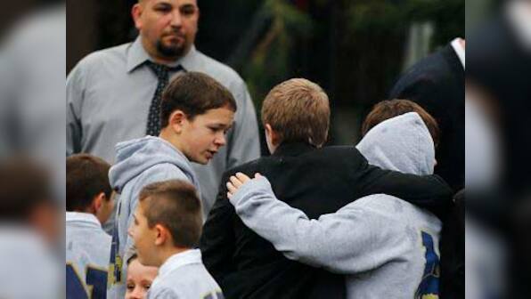Funerals begin for Newtown victims as U.S. schools confront tragedy