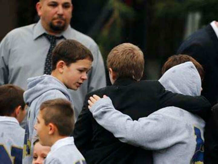 Funerals begin for Newtown victims as U.S. schools confront tragedy