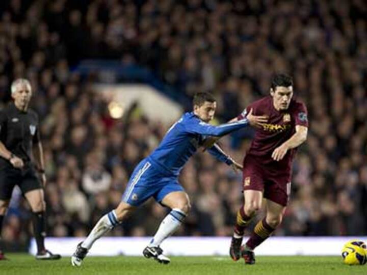 Man City's Barry charged with insulting match official