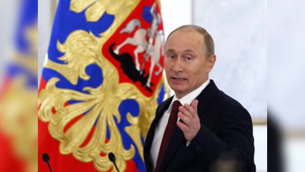 Putin signs law preventing Americans from adopting Russian children 