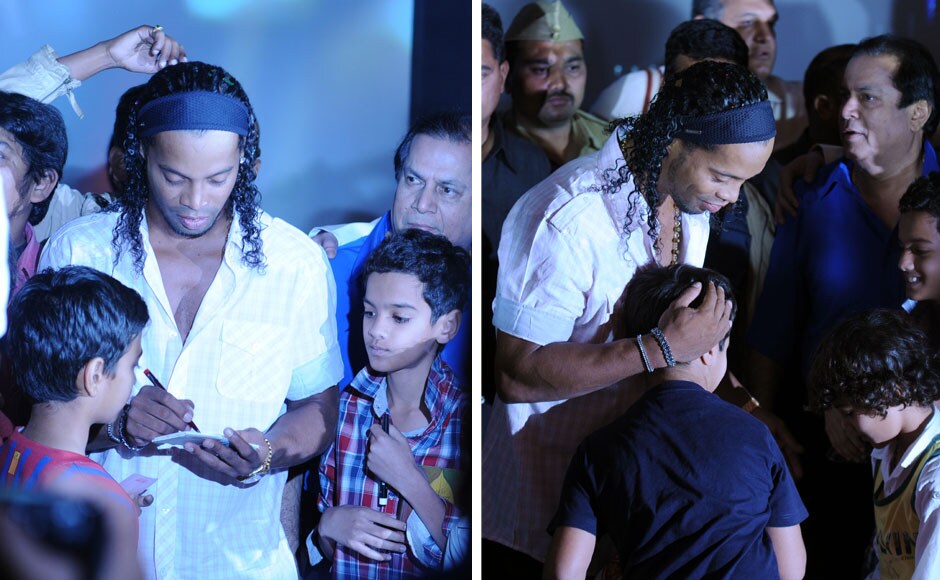 Ronaldinho obliging with the demands of his young fans. Sachin Gokhale/Firstpost.<br /> Ronaldinho obliging with the demands of his young fans. Sachin Gokhale/Firstpost.<br />